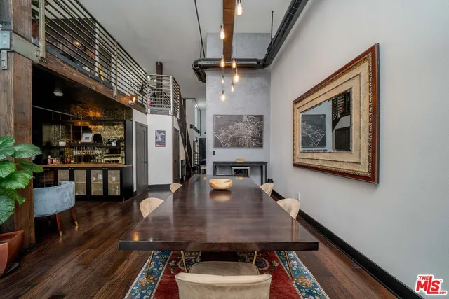 a dining room with furniture and wooden floor