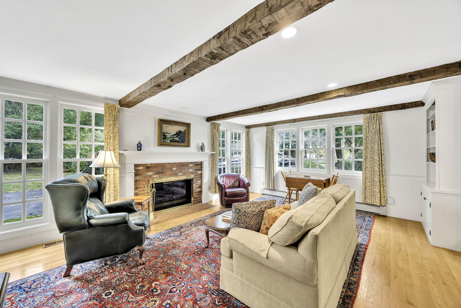 473 Davisville Road East Falmouth, MA 02536 - Photo 12 of 41 a living room with furniture and a fireplace