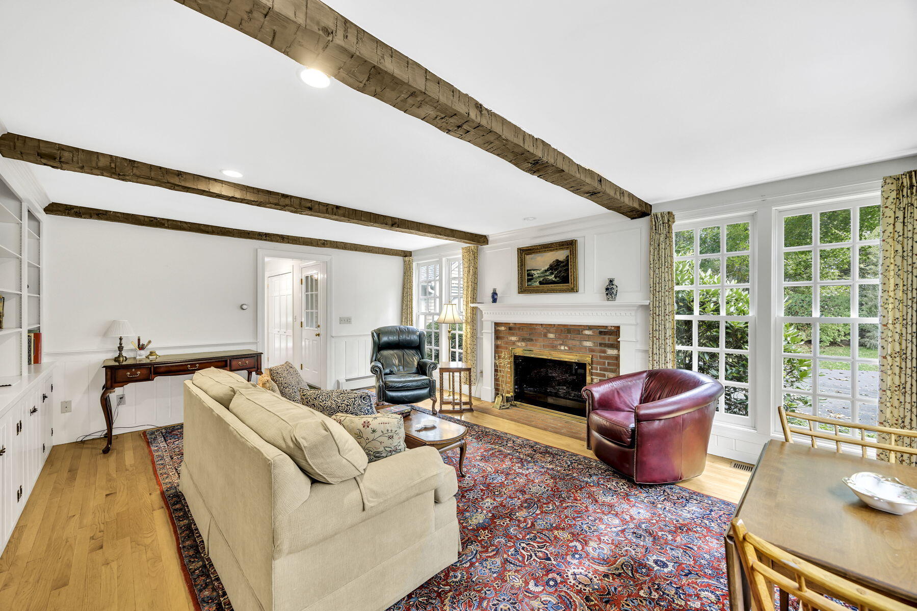 473 Davisville Road East Falmouth, MA 02536 - Photo 13 of 41 a living room with furniture and a fireplace
