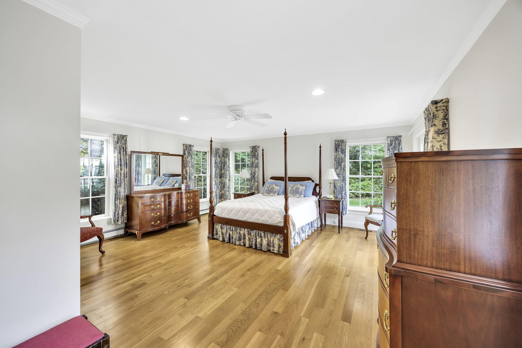 473 Davisville Road East Falmouth, MA 02536 - Photo 15 of 41 a bedroom with a bed couch and a large window