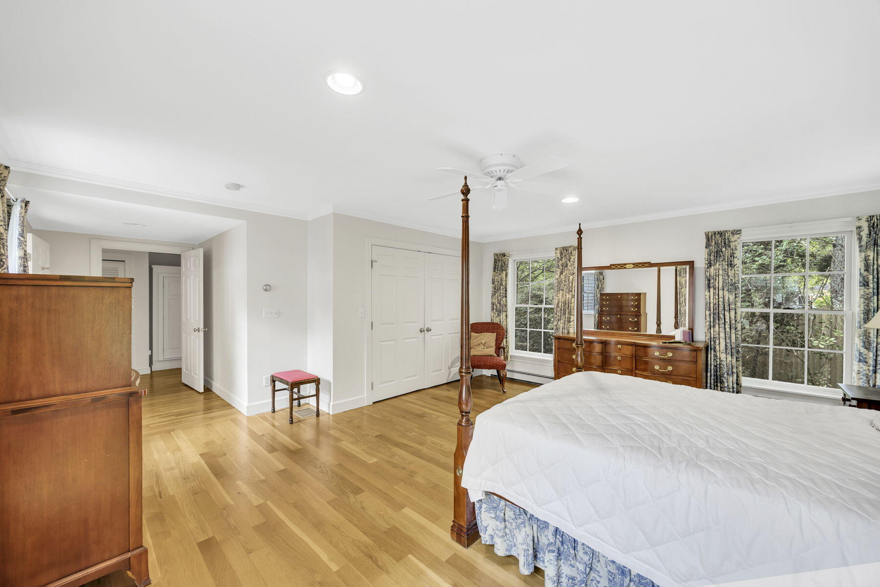 473 Davisville Road East Falmouth, MA 02536 - Photo 16 of 41 a spacious bedroom with a bed and a large window