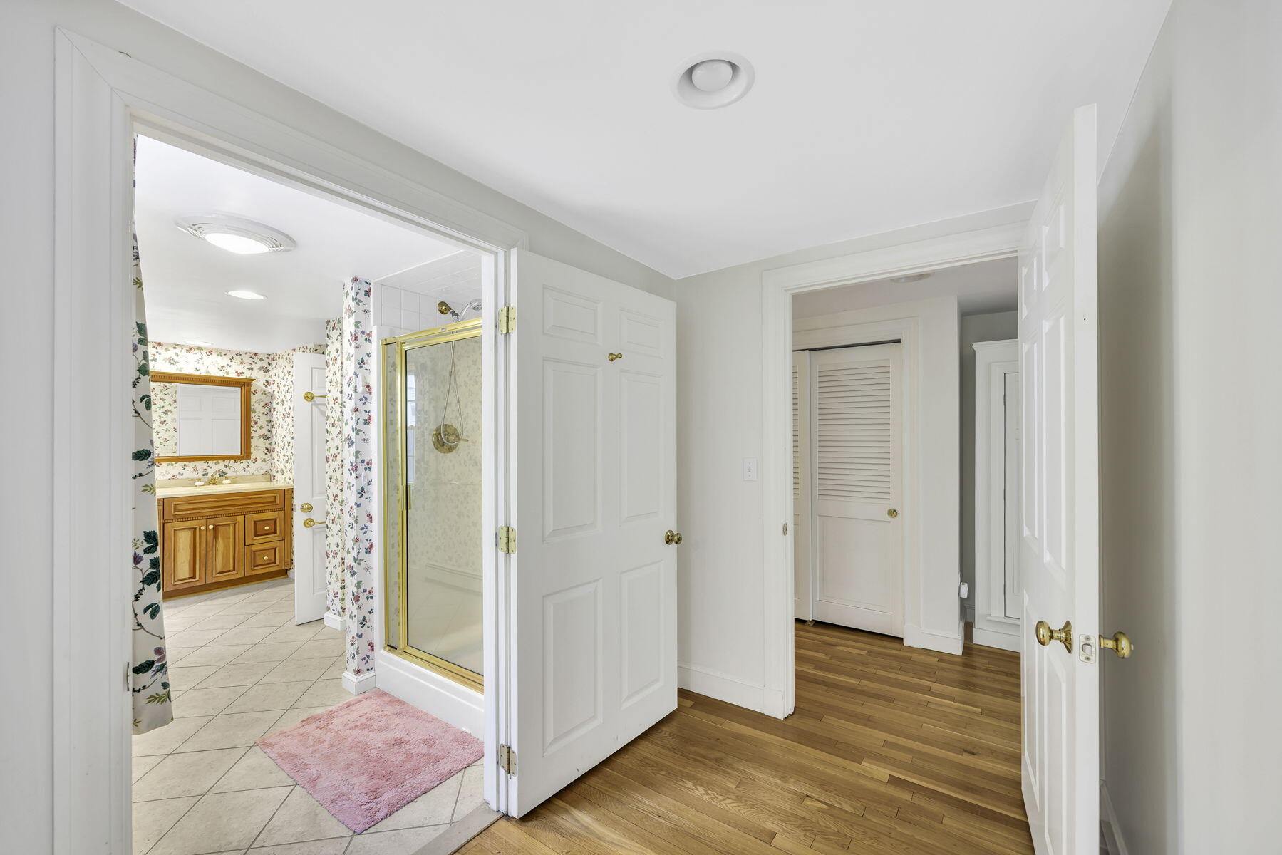 473 Davisville Road East Falmouth, MA 02536 - Photo 17 of 41 a view of a room with wooden floor and a bathroom