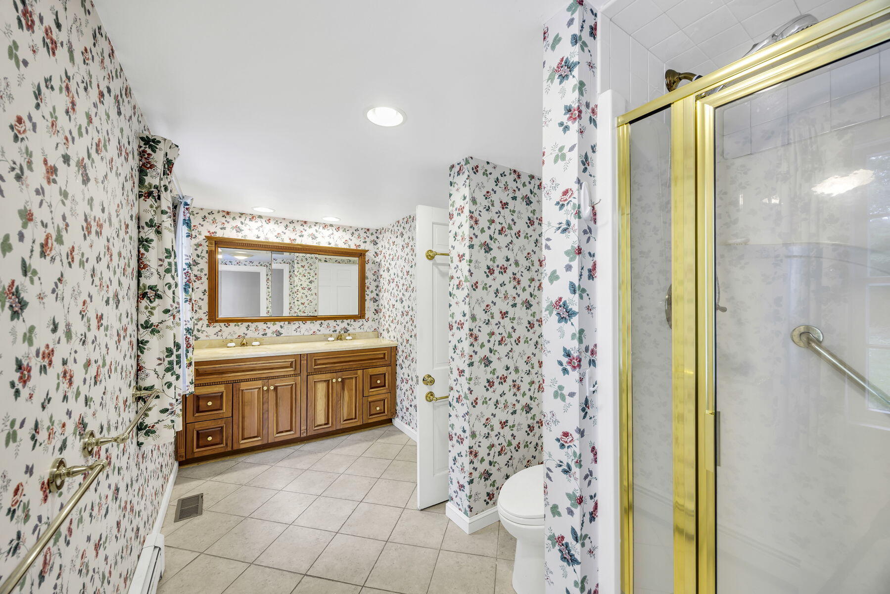 473 Davisville Road East Falmouth, MA 02536 - Photo 18 of 41 a large bathroom with a granite countertop sink a mirror and a shower