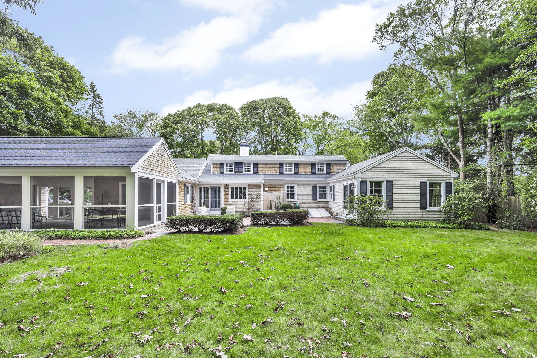473 Davisville Road East Falmouth, MA 02536 - Photo 2 of 41 a front view of a house with a garden