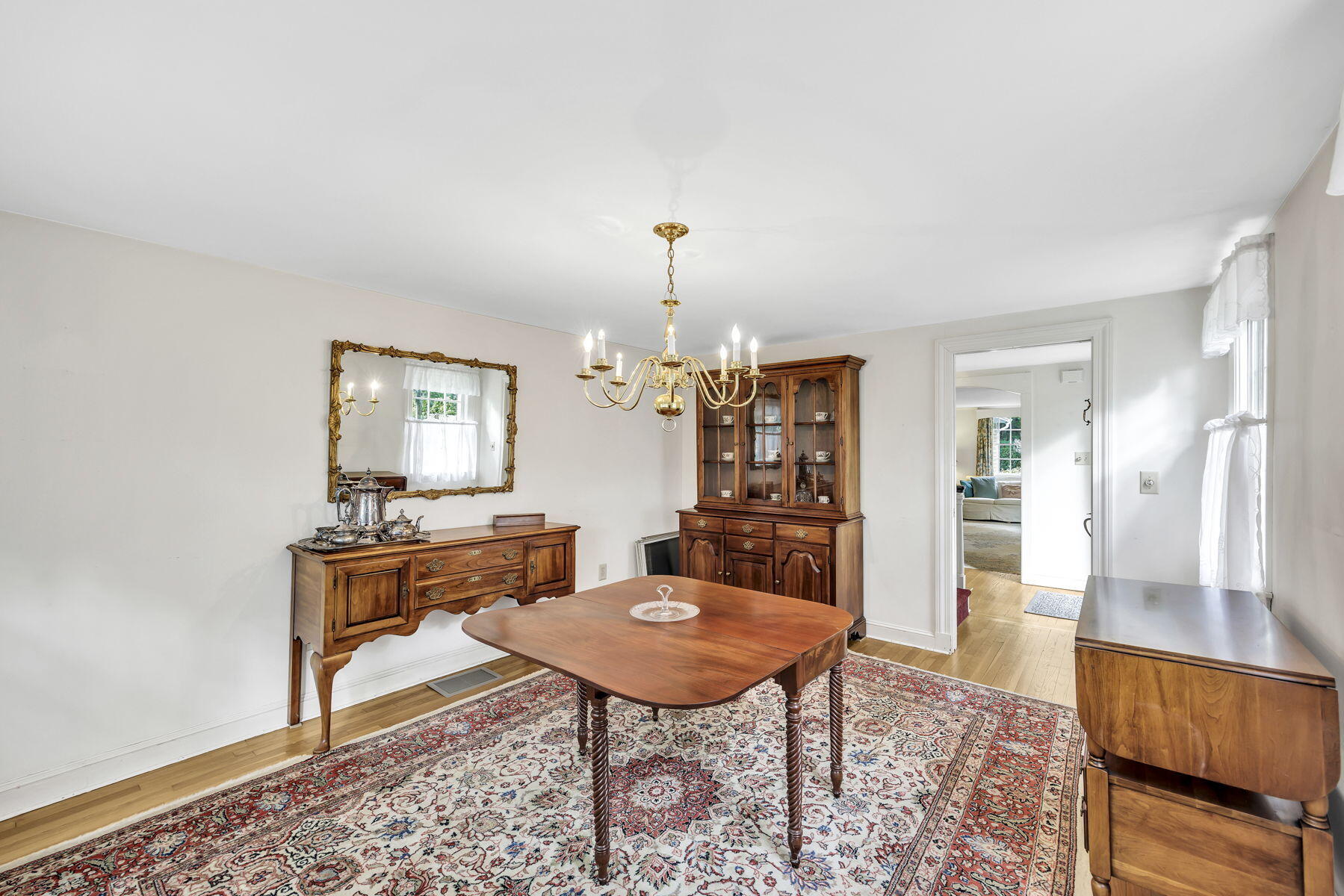 473 Davisville Road East Falmouth, MA 02536 - Photo 22 of 41 a living room with furniture and a wooden floor