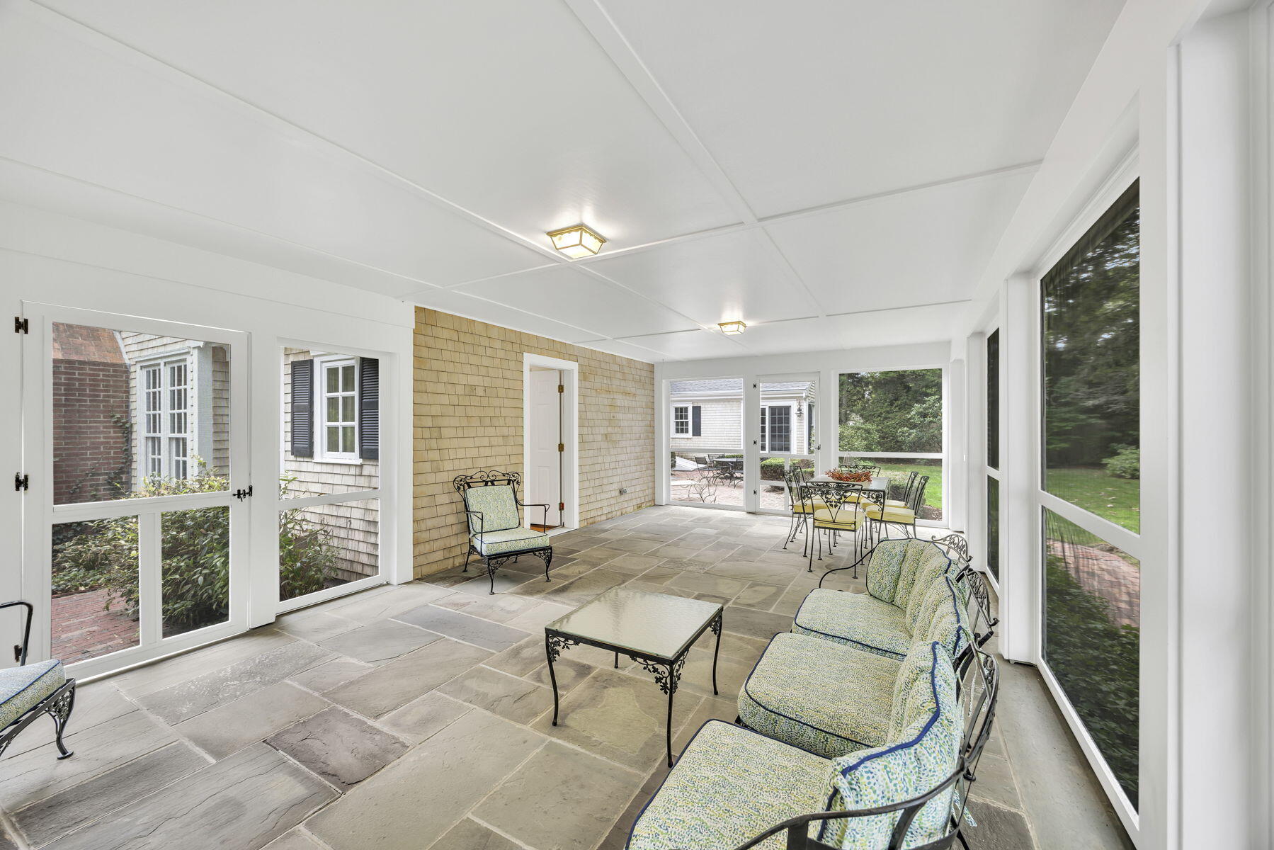 473 Davisville Road East Falmouth, MA 02536 - Photo 31 of 41 a living room with furniture stove and a table