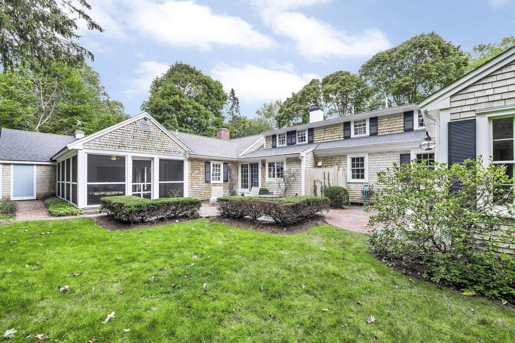 473 Davisville Road East Falmouth, MA 02536 - Photo 32 of 41 a front view of a house with a yard and green space