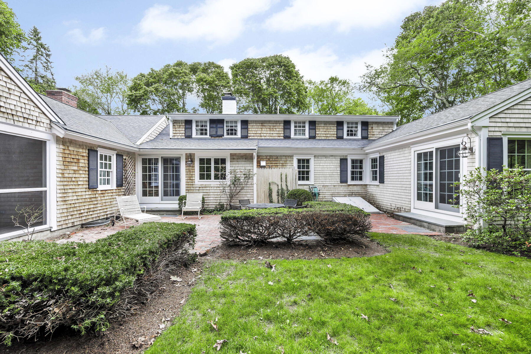 473 Davisville Road East Falmouth, MA 02536 - Photo 33 of 41 a front view of a house with a garden