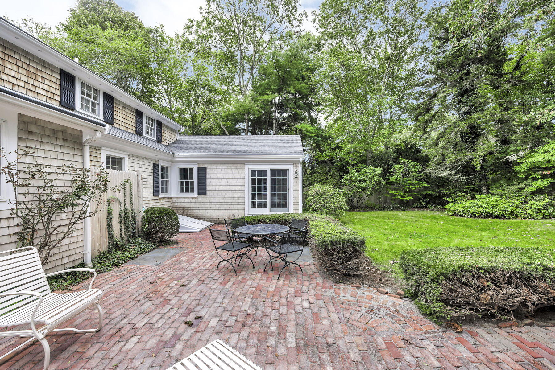 473 Davisville Road East Falmouth, MA 02536 - Photo 34 of 41 a backyard of a house with outdoor seating