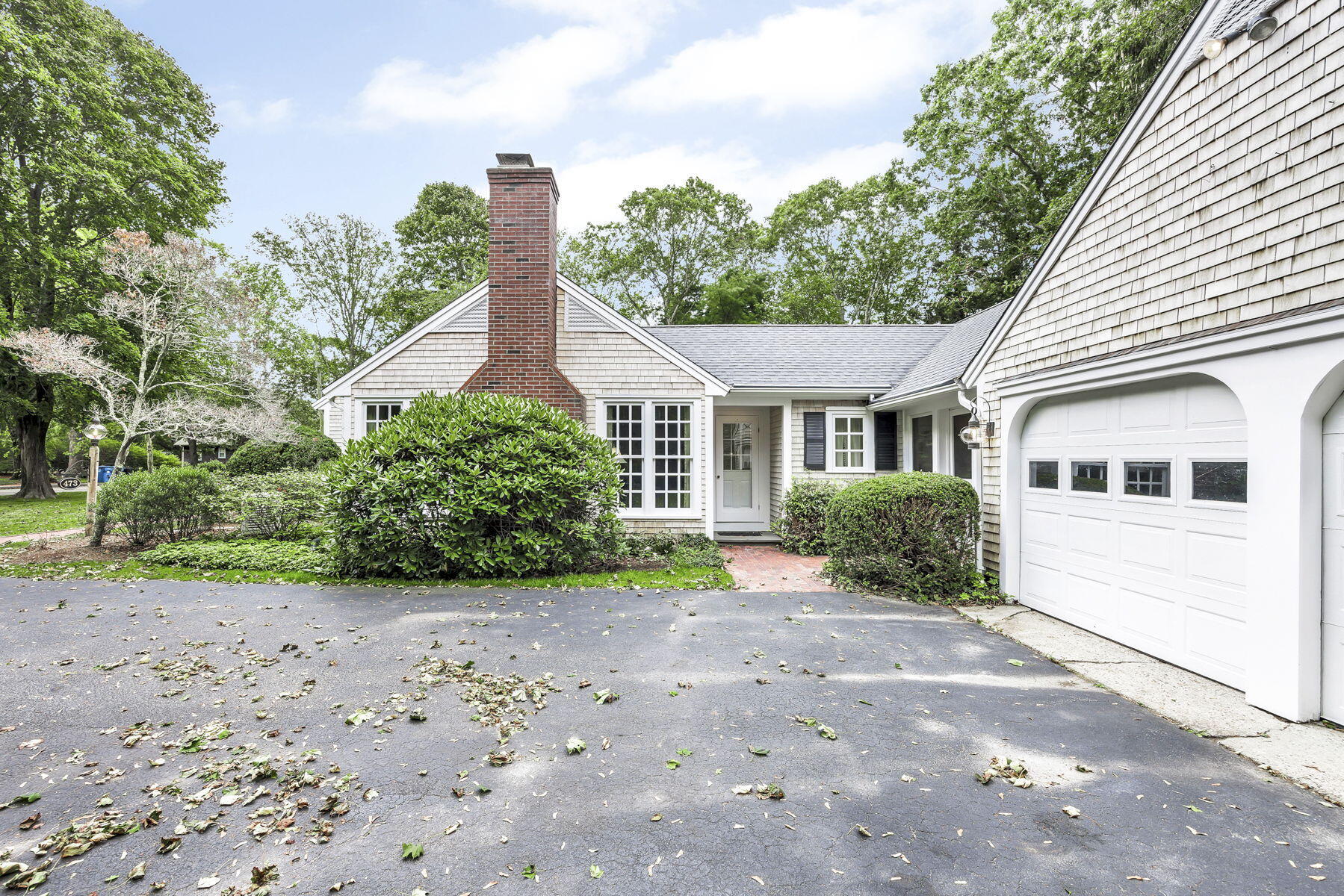 473 Davisville Road East Falmouth, MA 02536 - Photo 35 of 41 a front view of a house with a yard and garage