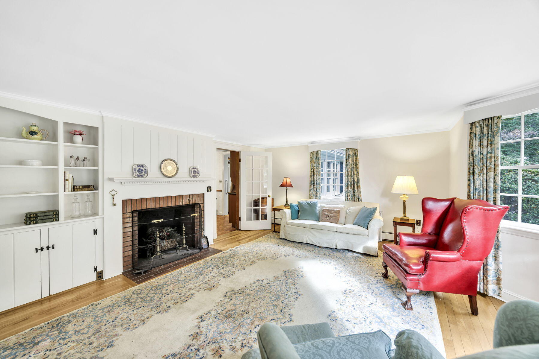 473 Davisville Road East Falmouth, MA 02536 - Photo 5 of 41 a living room with furniture a fireplace and a large window