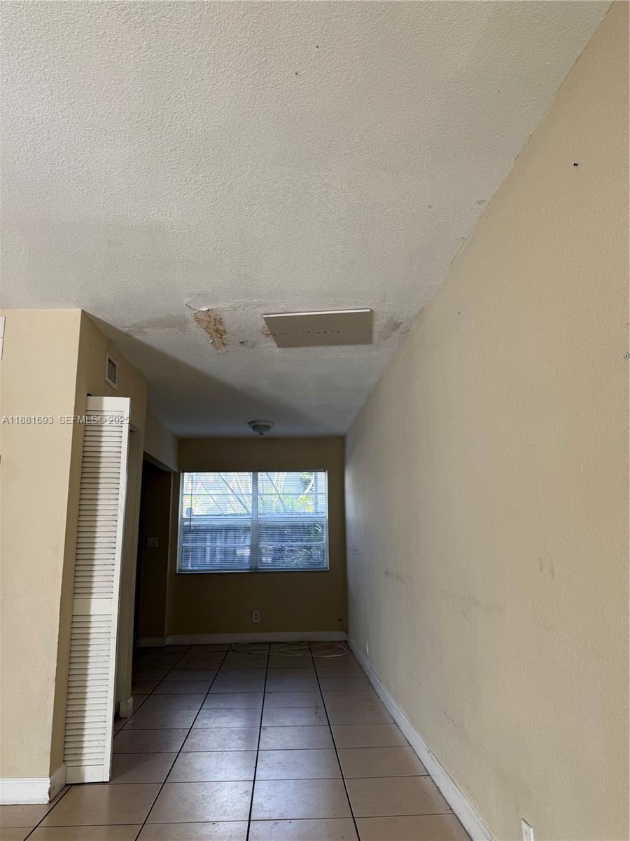 4625 Northwest 9th Drive, Unit 4625 Plantation, FL 33317 - Photo 14 of 26 a view of entryway with a hallway