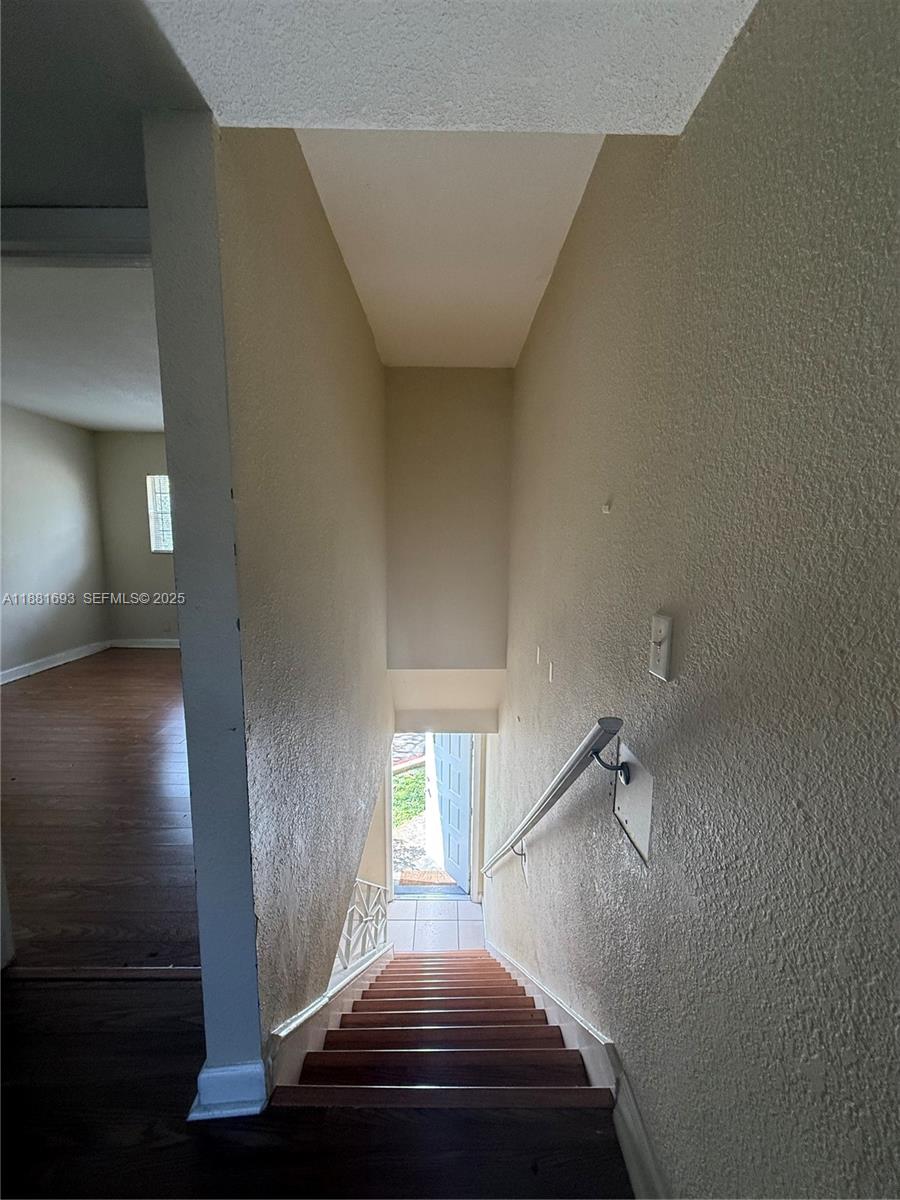 4625 Northwest 9th Drive, Unit 4625 Plantation, FL 33317 - Photo 16 of 26 a view of a livingroom with a staircase