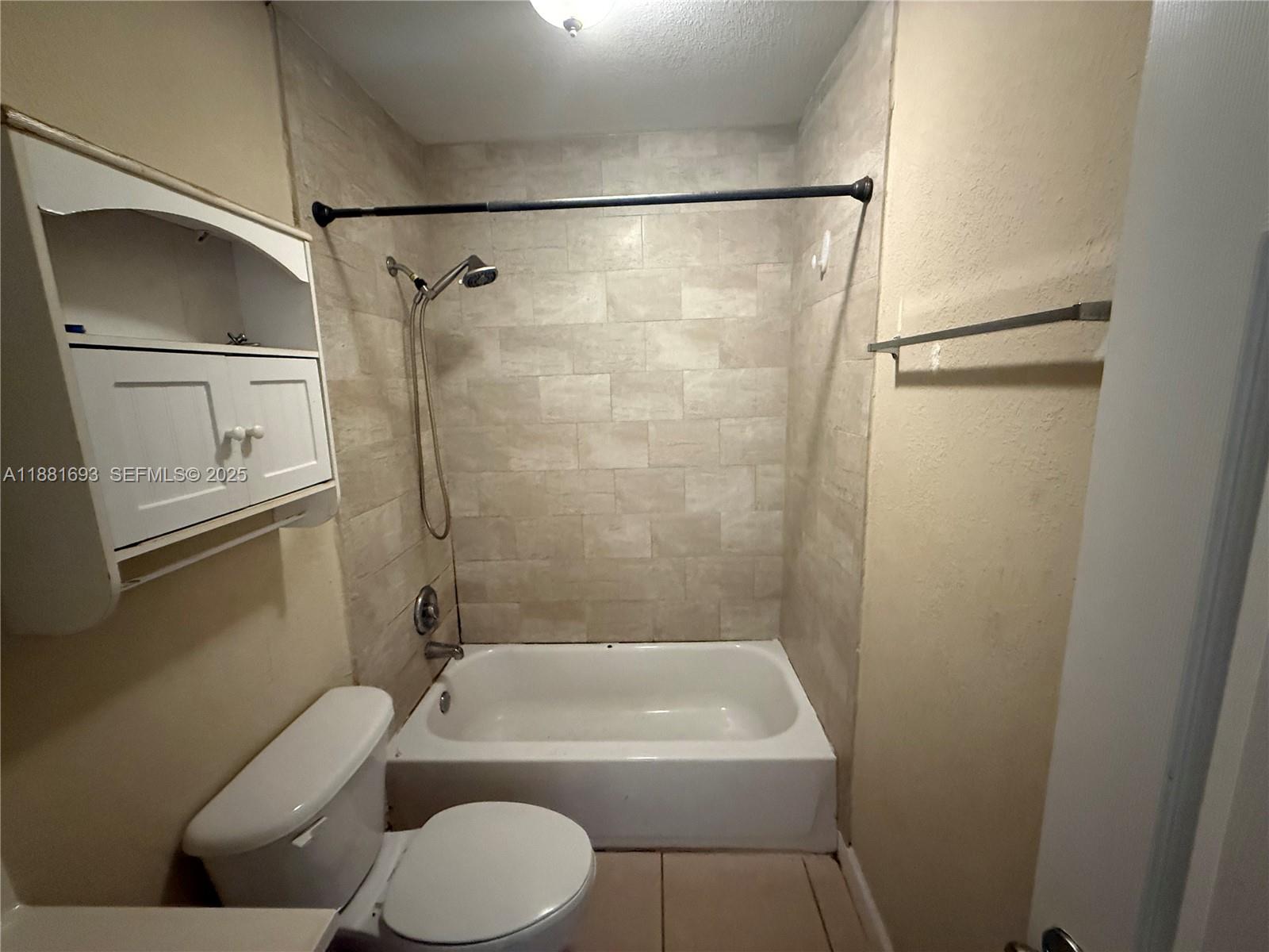 4625 Northwest 9th Drive, Unit 4625 Plantation, FL 33317 - Photo 20 of 26 a bathroom with a toilet and a shower