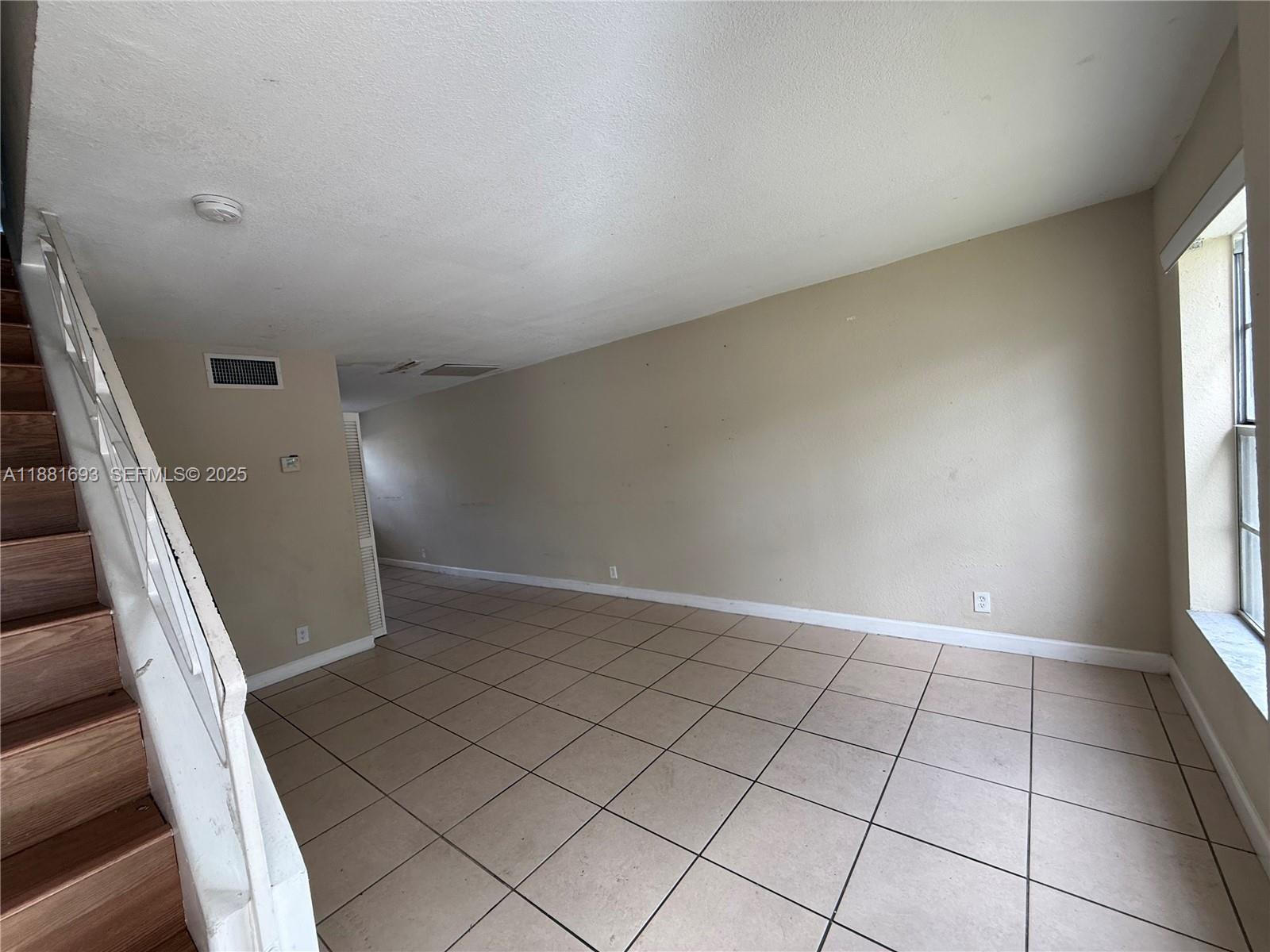 4625 Northwest 9th Drive, Unit 4625 Plantation, FL 33317 - Photo 9 of 26 a view of an empty room and window