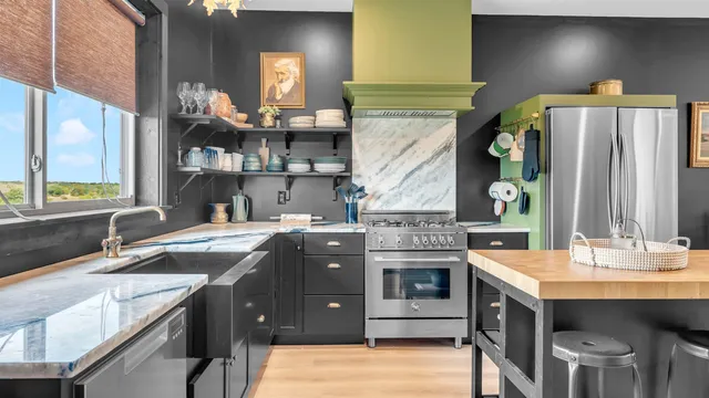 a bed room with a bed and a chair