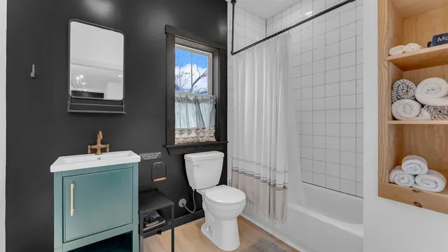 a bedroom with a bed and a dresser