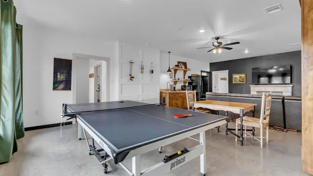 a living room with furniture a wooden floor and a window