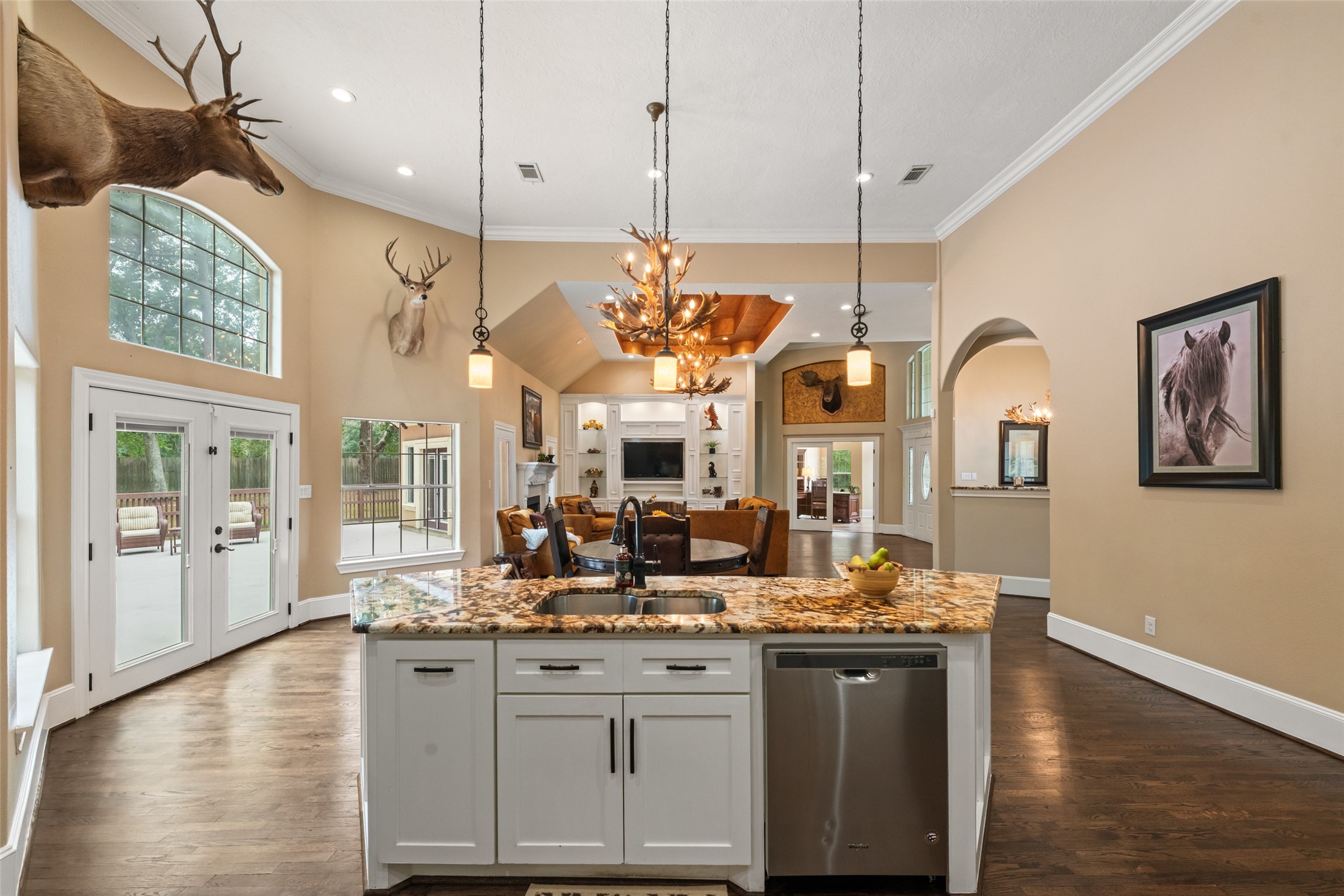 32660 Willow Bend Road Waller, TX 77484 - Photo 11 of 47 Generous center island provides additional prep and gathering space while maintaining an open connection to the dining and living areas.