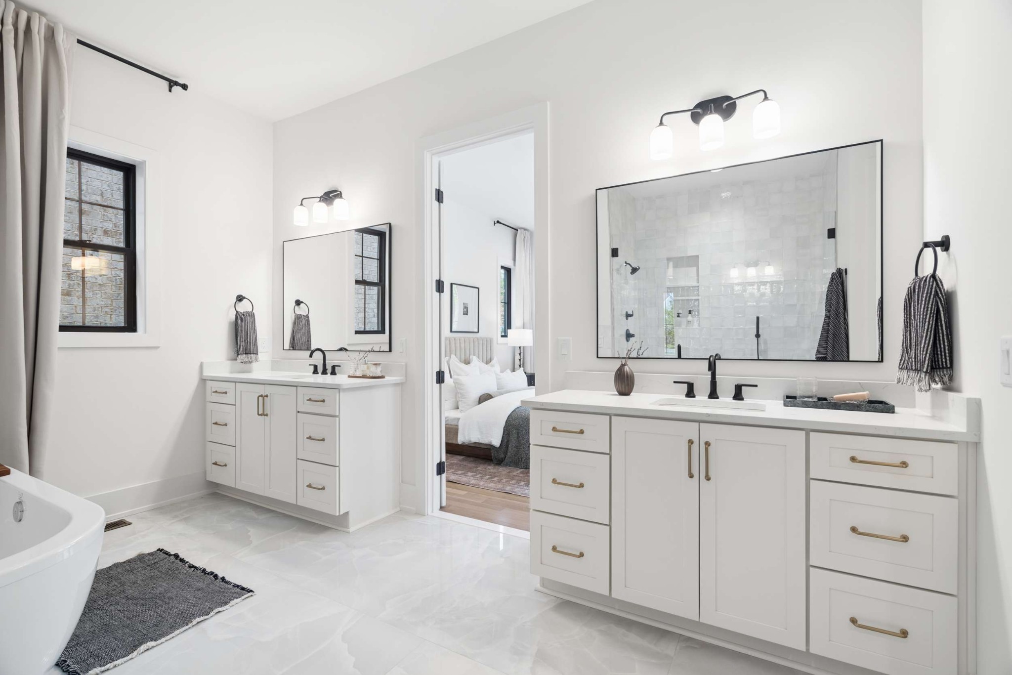 4209 B Kirtland Road Nashville, TN 37215 - Photo 29 of 69 a spacious bathroom with a double vanity sink a mirror a bathtub and a shower