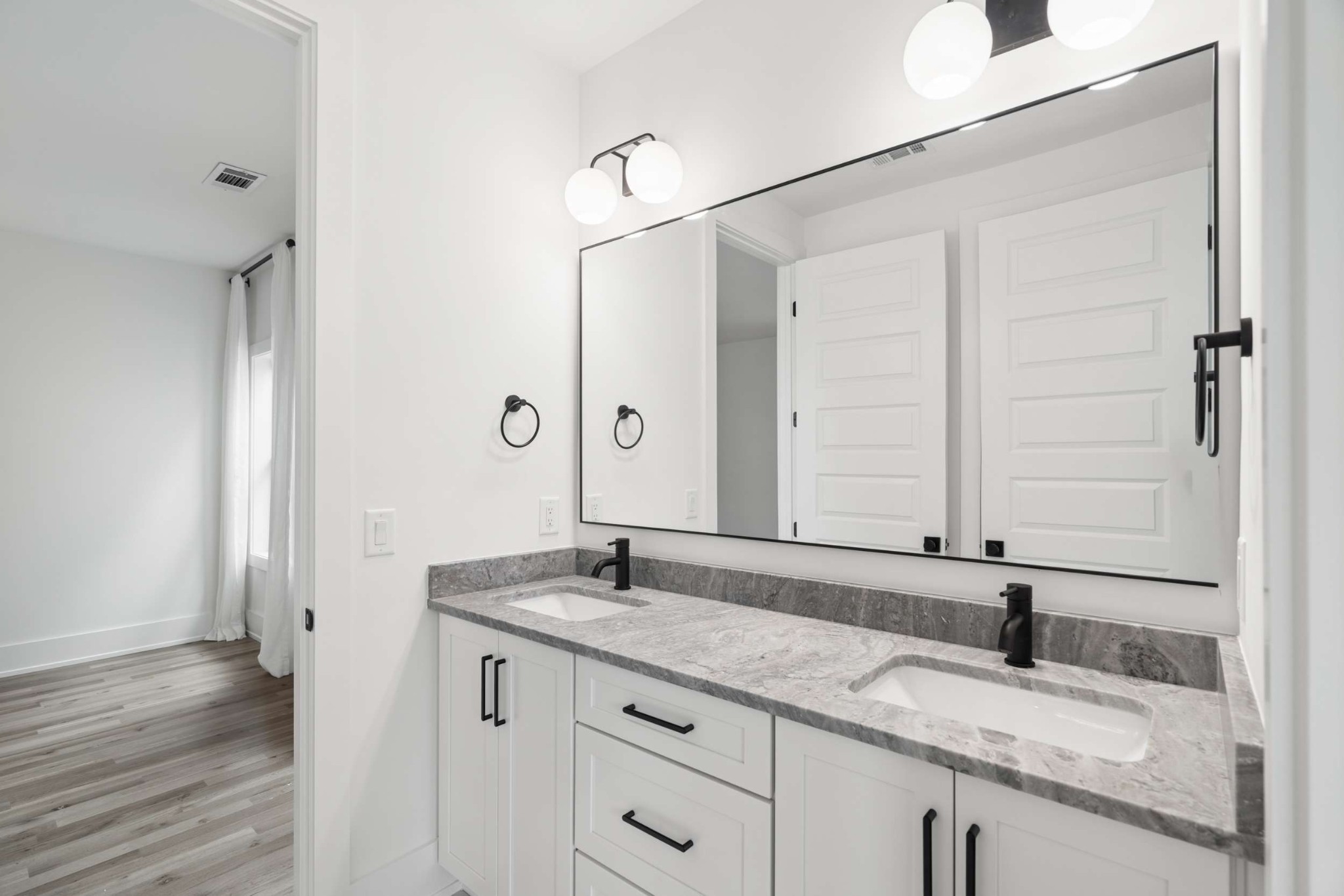 4209 B Kirtland Road Nashville, TN 37215 - Photo 38 of 69 a bathroom with a granite countertop sink and a mirror