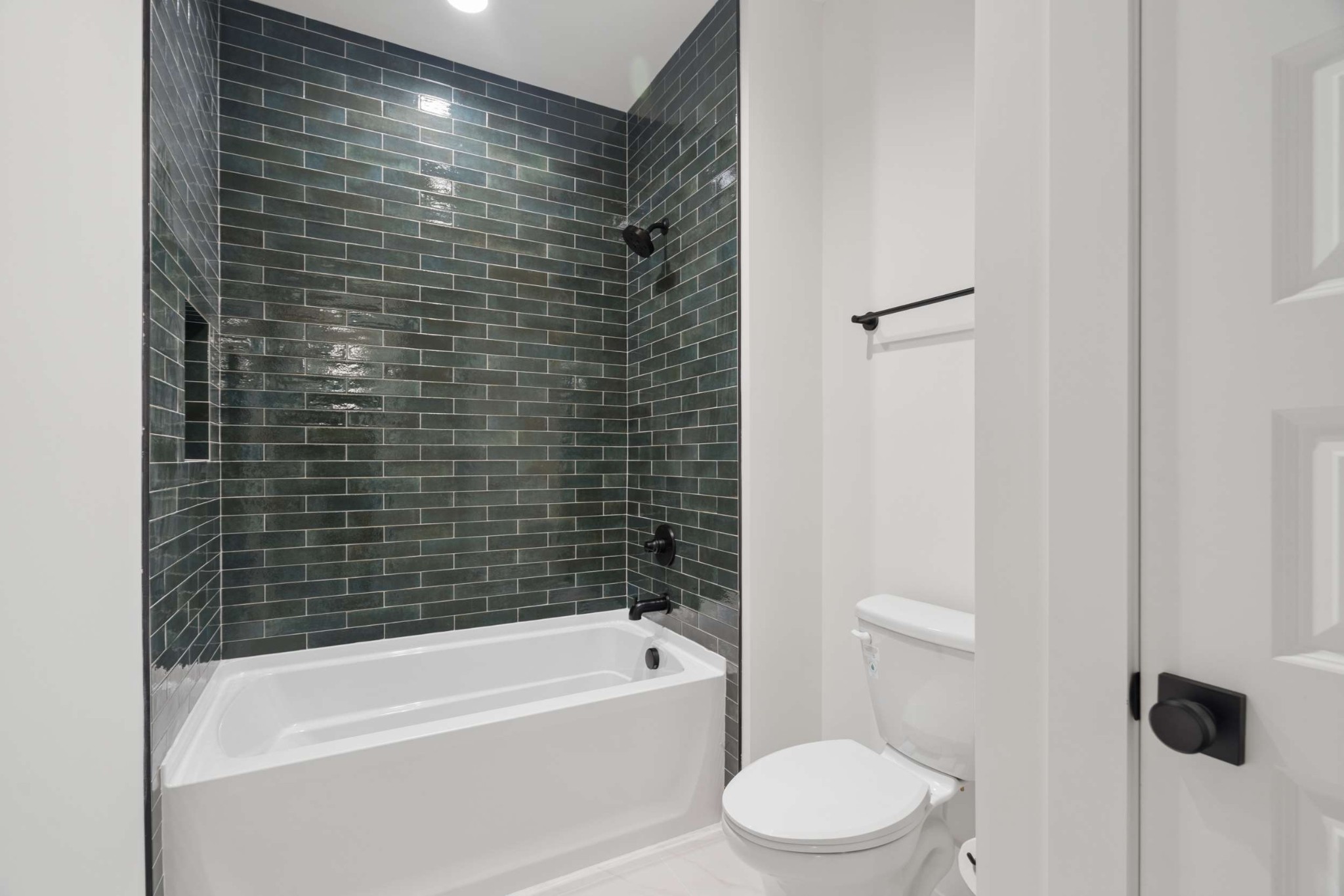 4209 B Kirtland Road Nashville, TN 37215 - Photo 39 of 69 a bathroom with a toilet and a bathtub