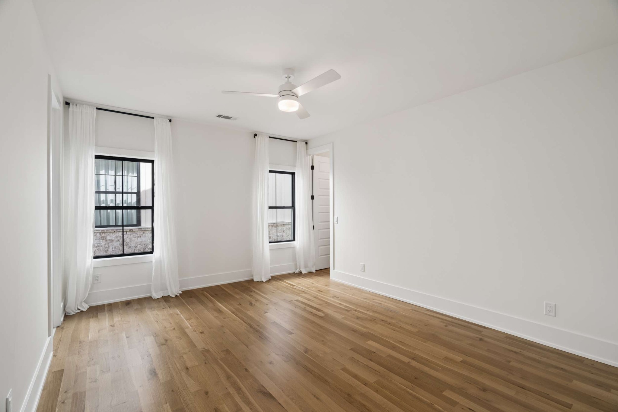 4209 B Kirtland Road Nashville, TN 37215 - Photo 43 of 69 an empty room with wooden floor cabinet and windows