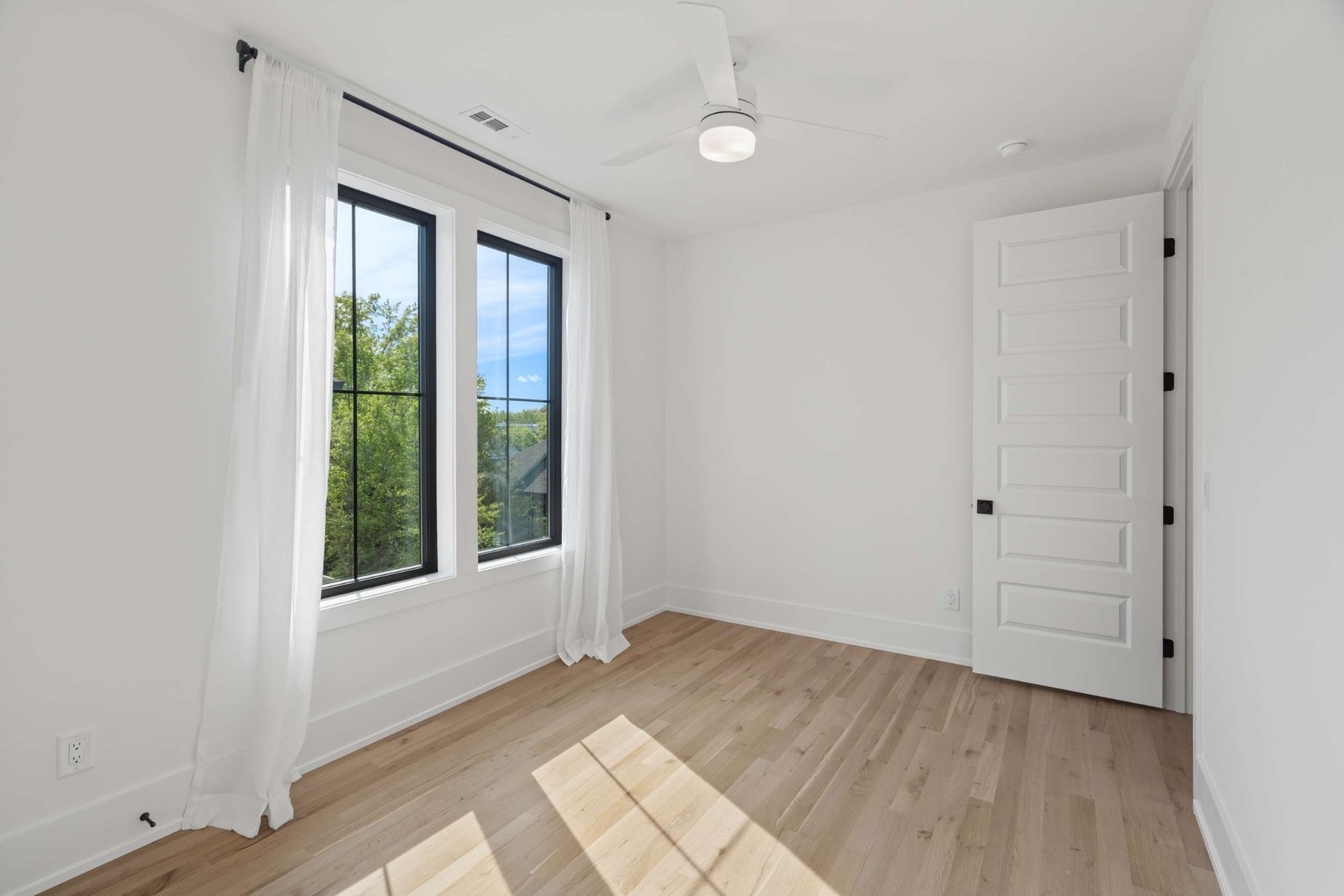 4209 B Kirtland Road Nashville, TN 37215 - Photo 49 of 69 a view of an empty room with wooden floor and a window