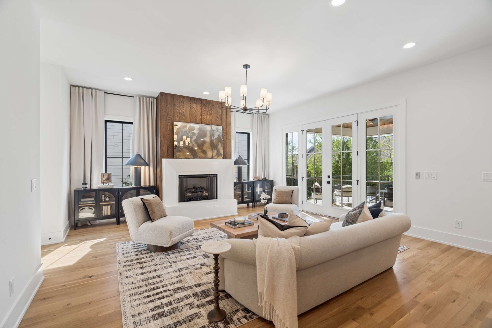 4209 B Kirtland Road Nashville, TN 37215 - Photo 7 of 69 a living room with furniture a fireplace and a chandelier
