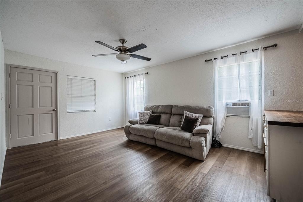 5 North Street Frostproof, FL 33843 - Photo 10 of 22 a living room with furniture and a wooden floor