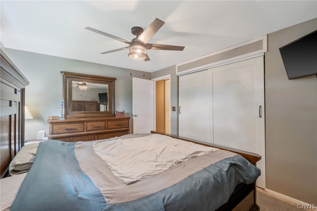 4346 Old Meadow Road Clay, NY 13041 - Photo 20 of 33 And the closet space is quite vast behind the slid