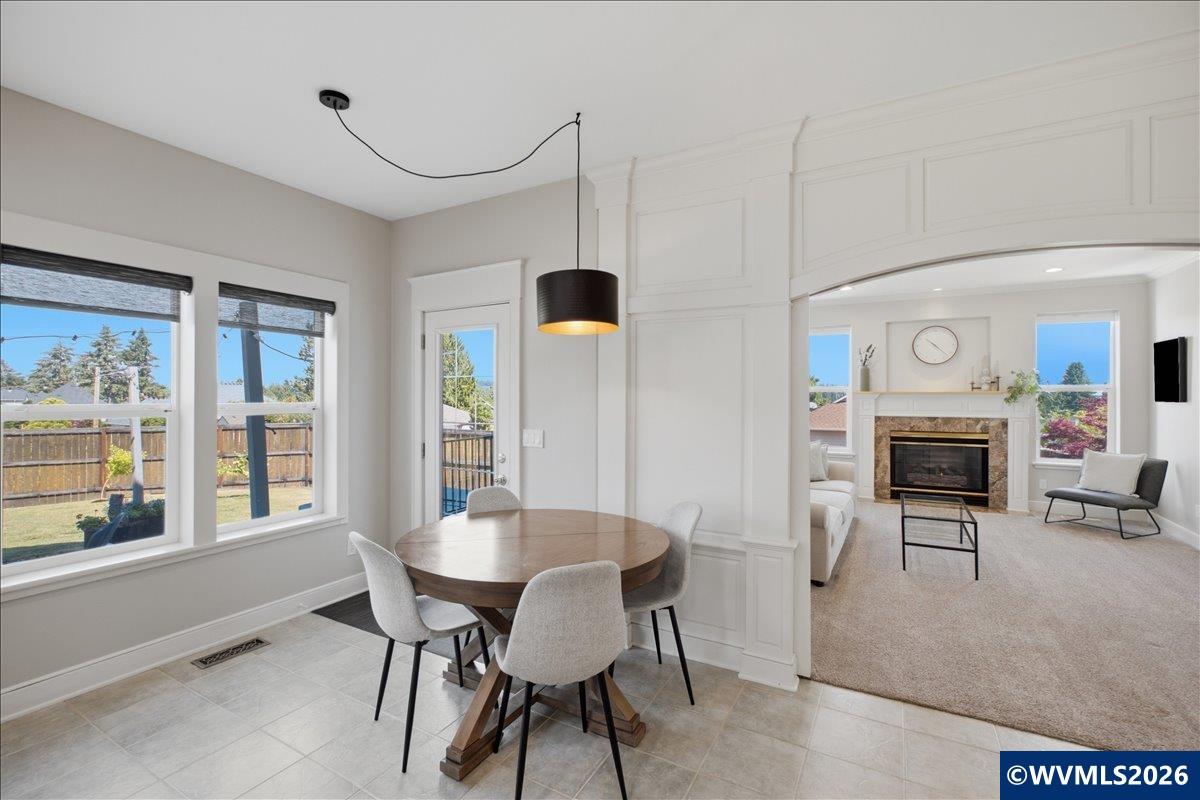 1492 Northwest Penny Lane Albany, OR 97321 - Photo 23 of 50 a view of a dining room with furniture window and outside view