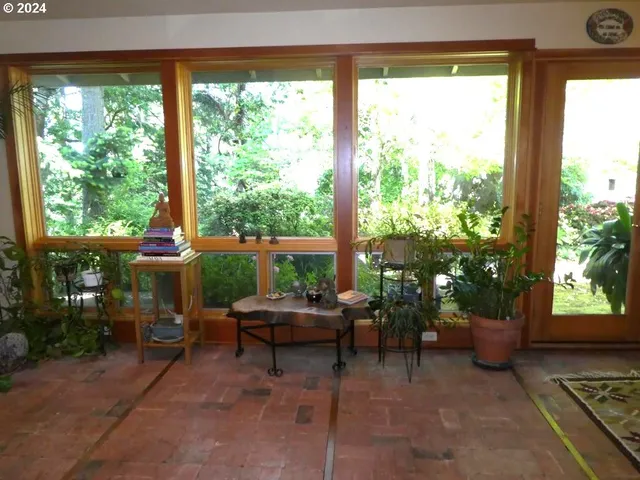 a living room filled with furniture and a yard