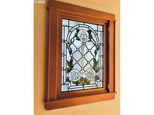 a bedroom with a bed and a dresser with closet