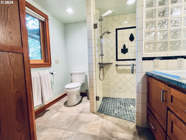 a bathroom with a shower and a sink