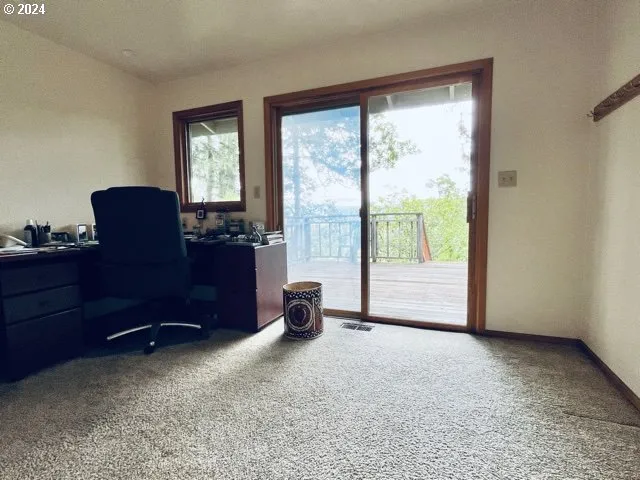 a bathroom with a granite countertop sink toilet and mirror