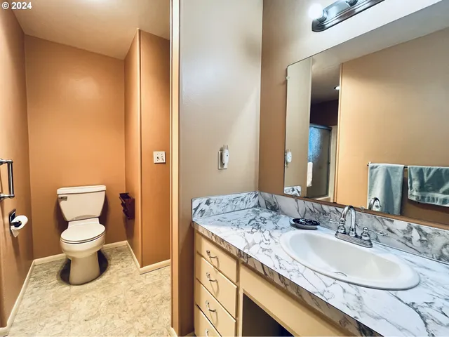 a dining room with furniture and garden view