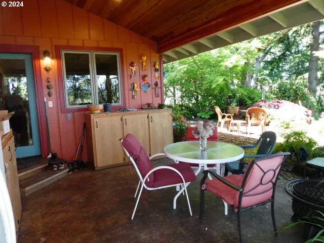a view of a deck with wooden floor and outdoor seating