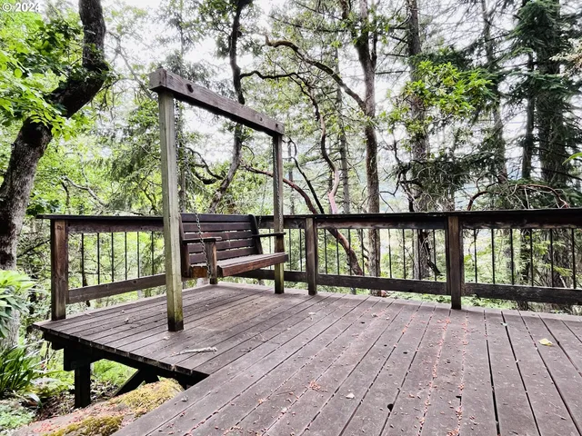 a backyard of a house with lots of green space and a fountain