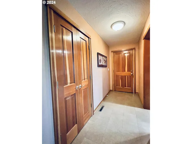 a view of a hallway with closet