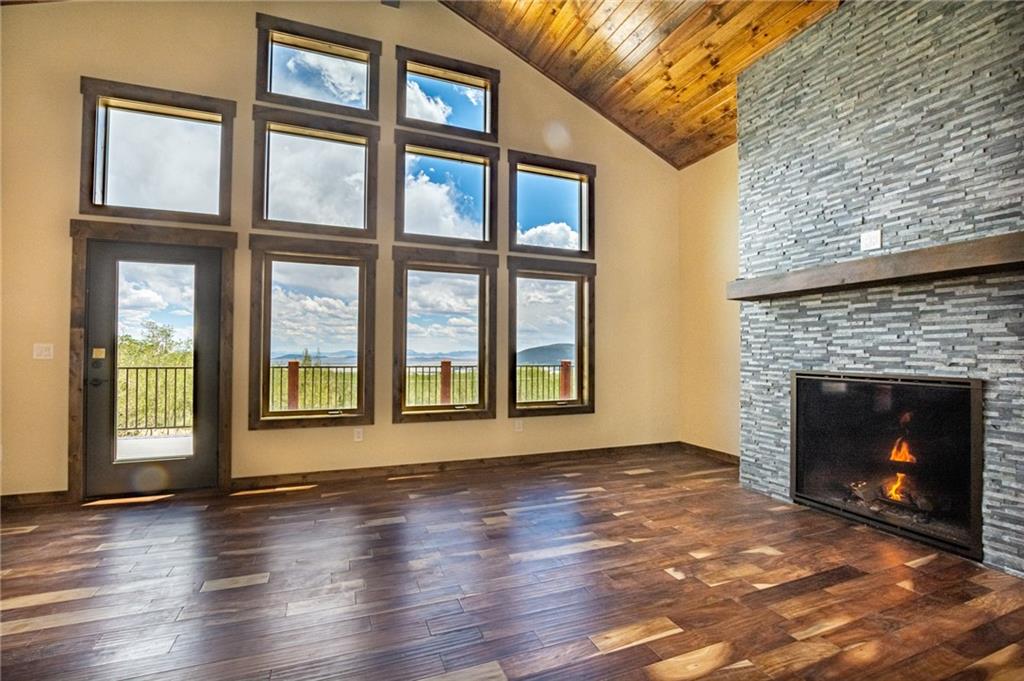 2267 High Creek Road Fairplay, CO 80440 - Photo 6 of 21 a view of an empty room with exposed radiator and fireplace
