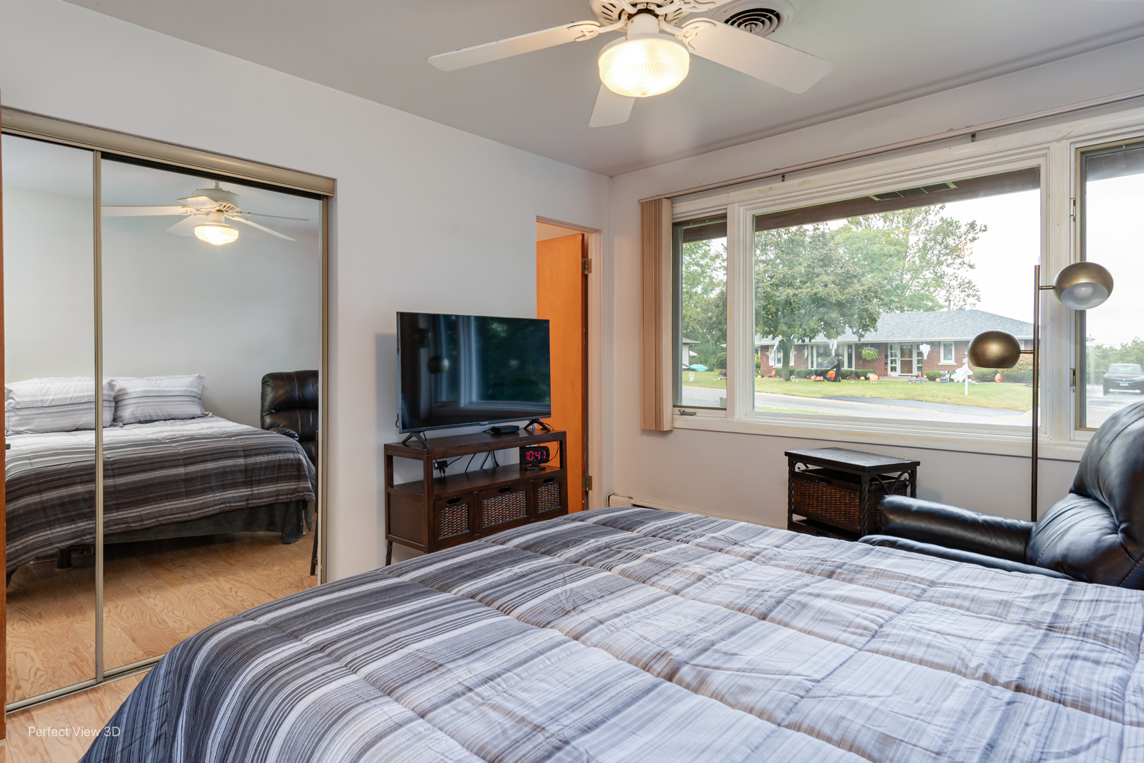2004 Boehme Street Lockport, IL 60441 - Photo 12 of 23 a bedroom with a bed and a chandelier