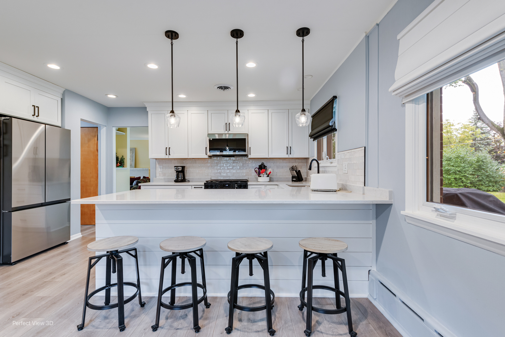 2004 Boehme Street Lockport, IL 60441 - Photo 3 of 23 a kitchen with stainless steel appliances kitchen island a table chairs sink and cabinets