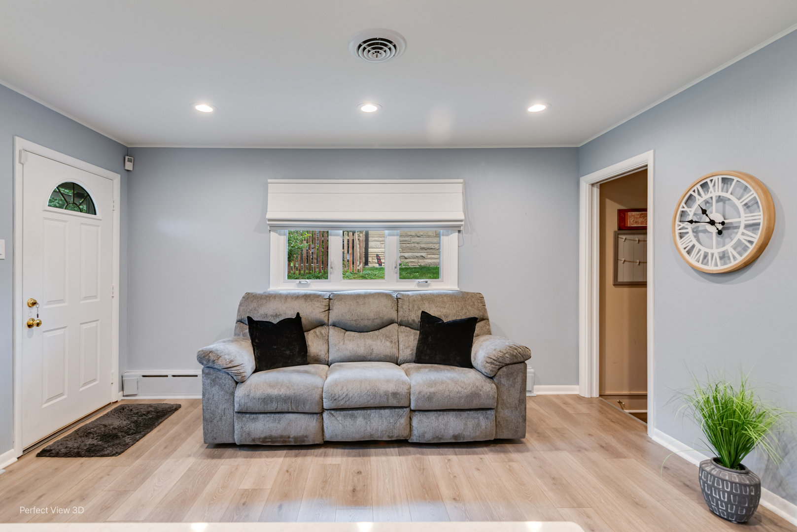 2004 Boehme Street Lockport, IL 60441 - Photo 6 of 23 a living room with furniture a clock and a window