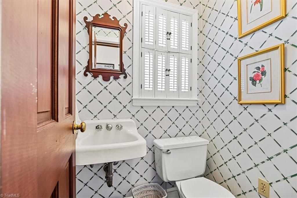 952 Nottingham Road High Point, NC 27262 - Photo 21 of 47 Half bathroom is located in the back hallway.
