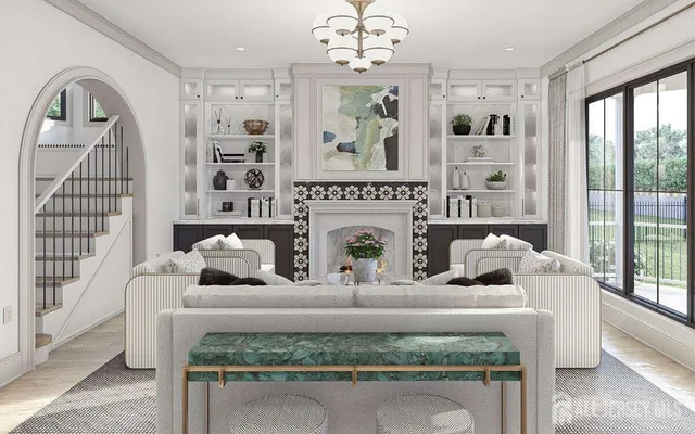 a living room with furniture a chandelier and a fireplace