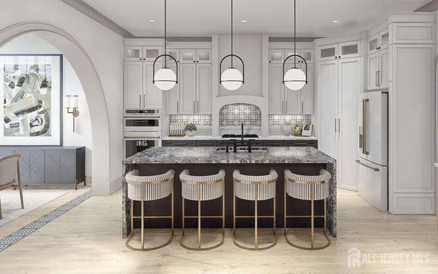 a kitchen with a dining table and chairs