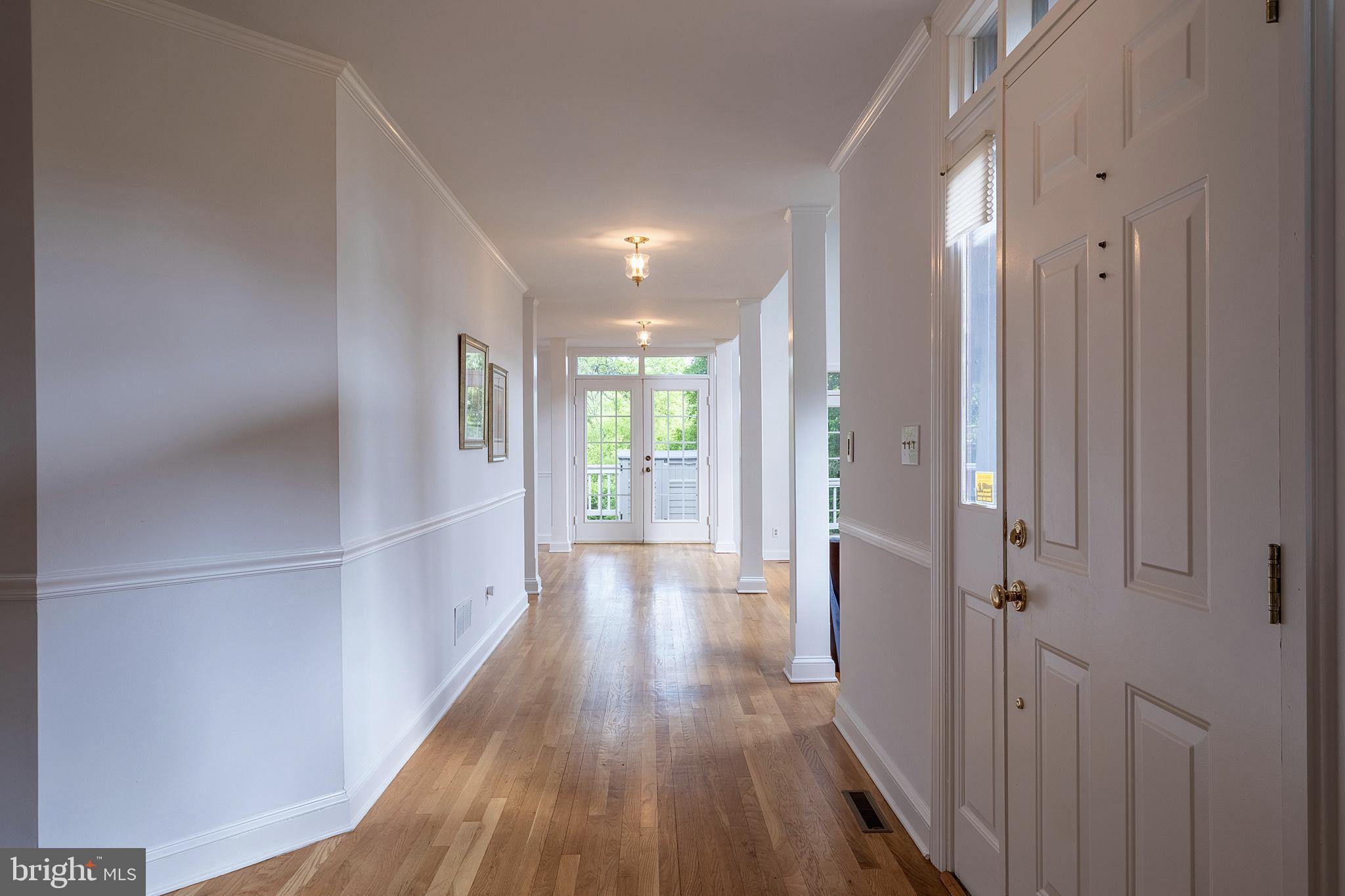 616 Scotch Road Pennington, NJ 08534 - Photo 4 of 46 Long hall with French doors to side deck