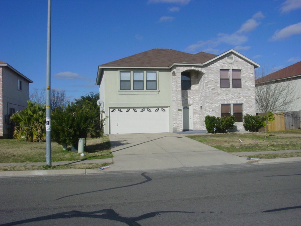 1367 Lakeside Loop Round Rock, TX 78665 - Photo 1 of 1 a front view of a house with a yard and garage