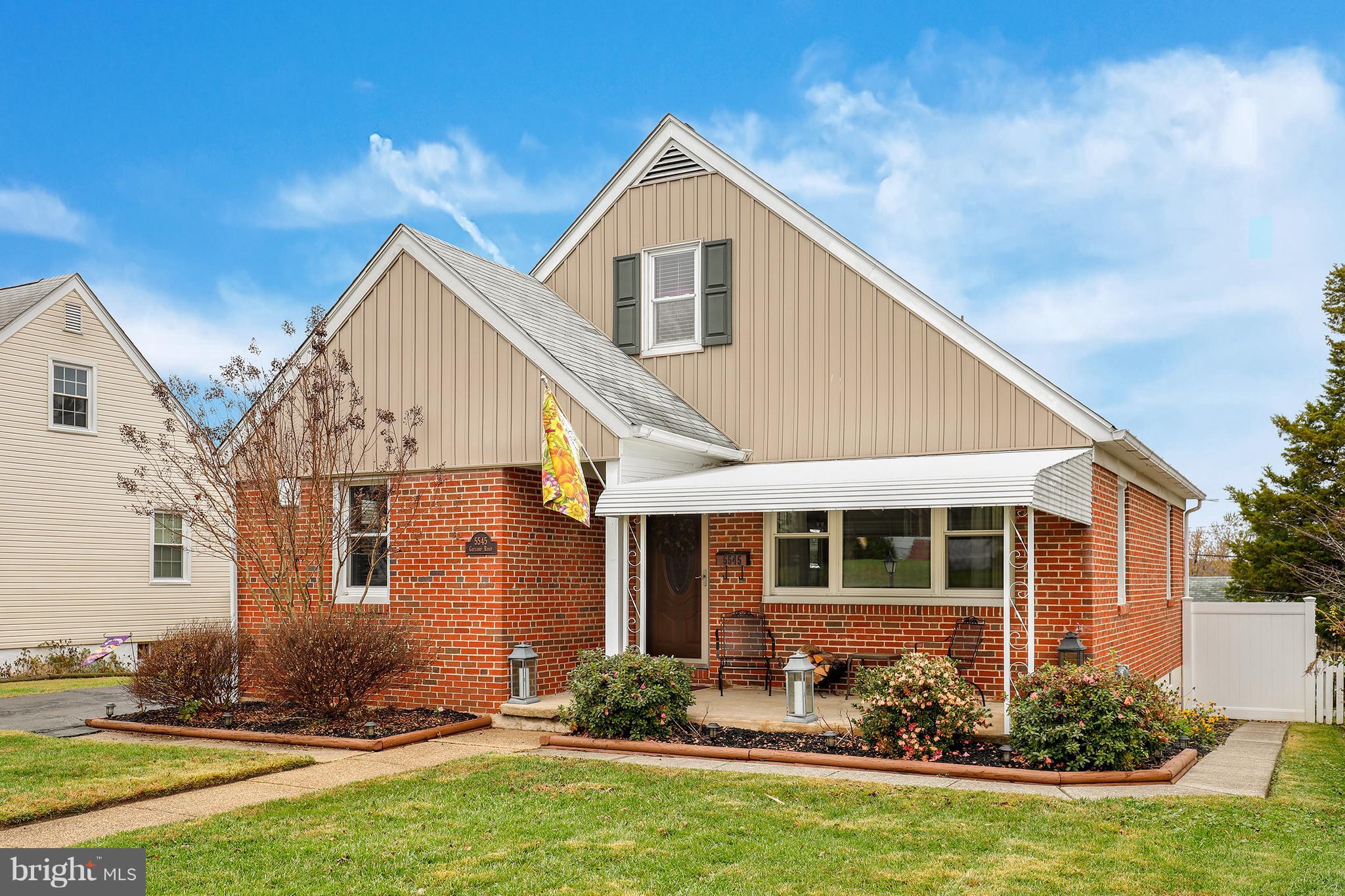 5545 Gayland Road Baltimore, MD 21227 - Photo 2 of 30 a front view of a house with yard